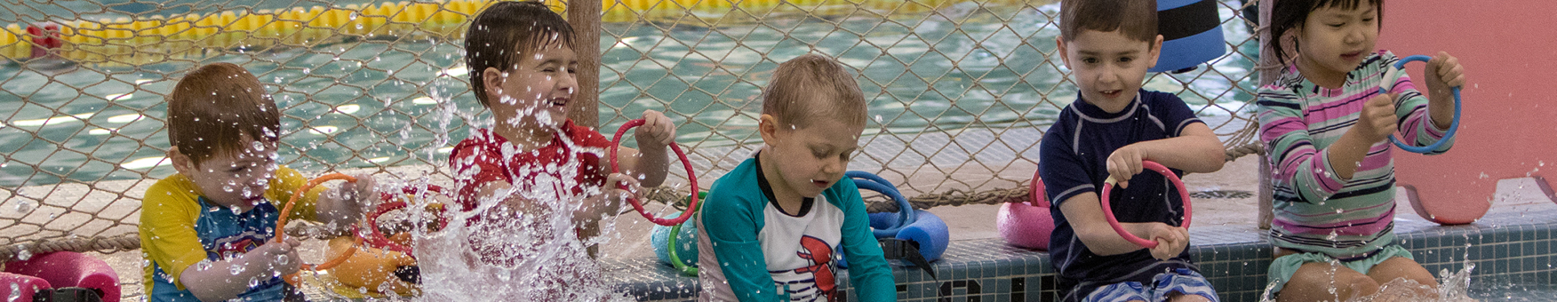 children splashing in the pool