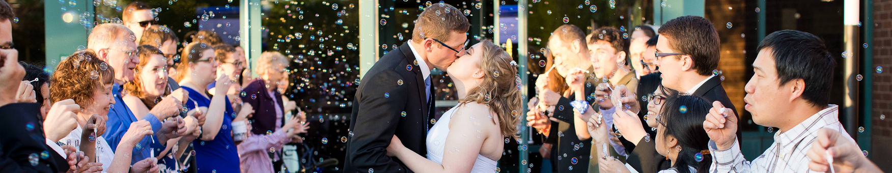 couple kissing outside the community center. eric vest photography